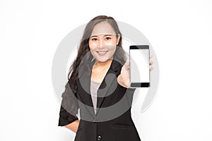 Beautiful Asian business woman wearing black suit hand holding a smartphone presenting something on white background and copy