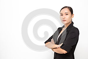 Beautiful Asian business woman wearing black suit with her crossed arms on white background and copy space.  Confident Asian