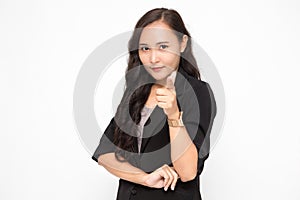 Beautiful Asian business woman wearing black suit pointing finger at camera presenting something on  white background and copy
