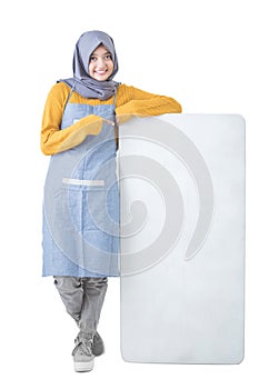 Beautiful Asian cafe owner holding blank white board