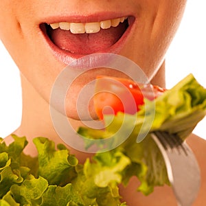 Beautiful asian caucasian woman with a white bowl of mixed salad