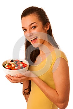 Beautiful asian caucasian woman with a white bowl of mixed salad