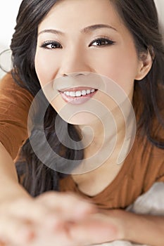 Beautiful Asian Chinese Woman Reaching To Camera