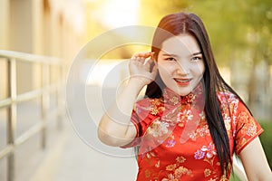 Beautiful Asian Chinese women charming dressing Qipao traditional cloth in Chinese New Year