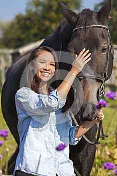 Beautiful Asian Eurasian Girl Leading Her Horse