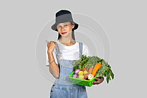 Beautiful Asian Farmer Nepali Indian Girl with Fruits and Vegetable giving expressions and gestures