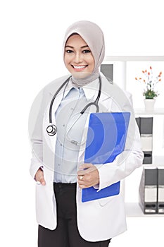 Beautiful asian female doctor with stethoscope and pad