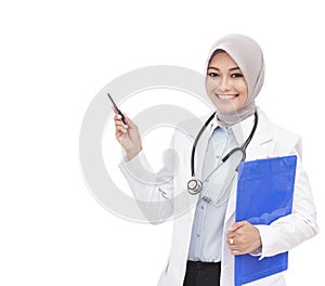 Beautiful asian female doctor with stethoscope pointing at blank