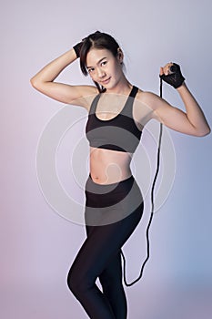 Beautiful asian fitnesses woman in studio