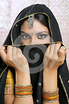 Beautiful asian girl with black veil on face