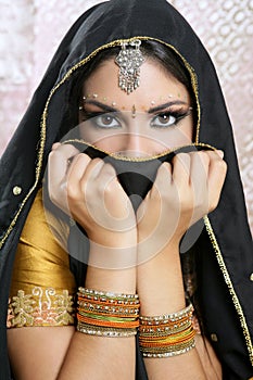 Beautiful asian girl with black veil on face