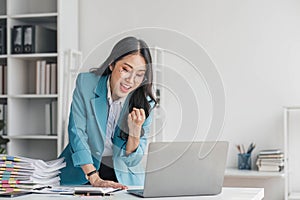 Beautiful Asian girl celebrate with laptop, success happy pose. E-commerce, university education, internet technology