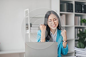 Beautiful Asian girl celebrate with laptop, success happy pose. E-commerce, university education, internet technology