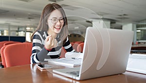 Beautiful Asian girl celebrate with laptop, Success or happy pose, Education or technology or startup business concept, Modern off