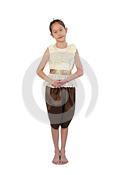 Beautiful Asian girl child in traditional Thai costume dress composed standing posture isolated on white background. Image full photo