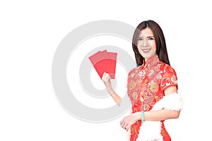 Beautiful Asian girl in Chinese qipao traditional dress, holding red money pockets or greeting card envelopes