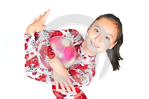 Beautiful Asian girl gymnast with a ball