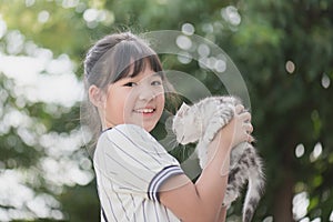 Beautiful Asian girl holding Lovely kitten