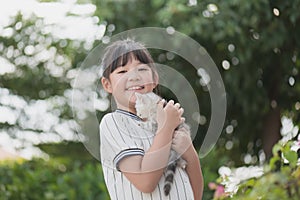 Beautiful Asian girl holding Lovely kitten