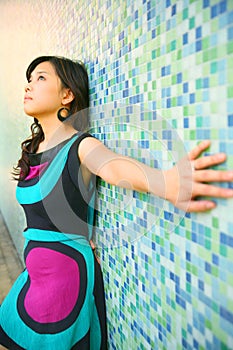 Beautiful Asian Girl Lean Back On Blue Wall
