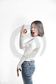 Beautiful asian girl making OK sign