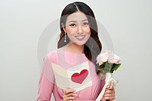 Beautiful asian girl reads love letter. Happy woman day.