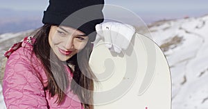 Beautiful asian girl with snowboard