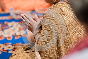 Beautiful Asian girl to pay respect and praying Buddhism worshiping Buddha statue with faith. Hands begging, put your hands togeth