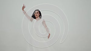 Beautiful Asian Girl wearing a white dress with a happy face for her graduation