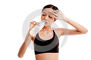 Beautiful Asian healthy girl with bottle of drinking water