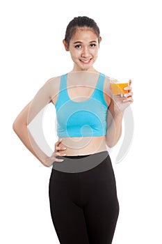 Beautiful Asian healthy girl drinking orange juice