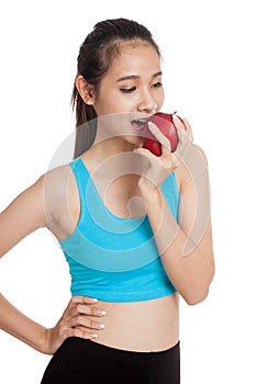 Beautiful Asian healthy girl eat red apple