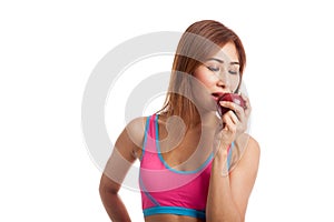 Beautiful Asian healthy girl eat red apple