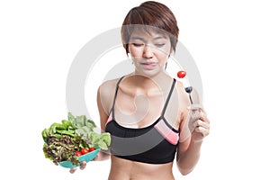 Beautiful Asian healthy girl enjoy eating salad.