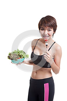 Beautiful Asian healthy girl enjoy eating salad.