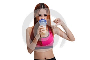 Beautiful Asian healthy girl thumbs down hate whey protein.