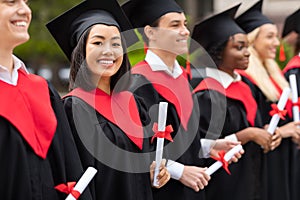 Beautiful asian lady standing among international group of students