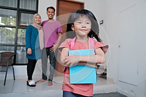 beautiful asian primary student going to school in the morning