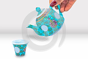 Beautiful Asian Tea Pot and Cup Set with Floral patterns Mockup