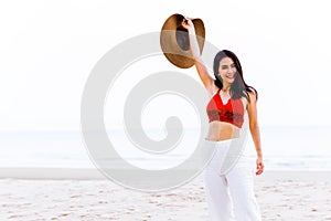 Beautiful asian Thai model girl happy fun on sea beach