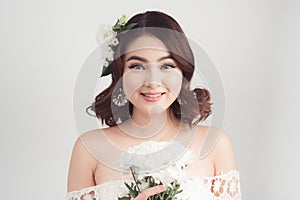 Beautiful asian woman bride on grey background. Closeup portrait