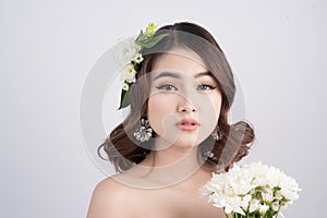 Beautiful asian woman bride on grey background. Closeup portrait