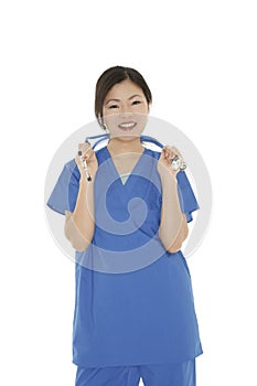 Beautiful Asian woman doctor or nurse wearing scrubs