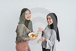 Woman enjoy ketupat and opor ayam photo