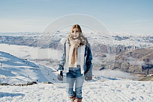 Beautiful asian woman enjoy view with snow during winter in New Zealand