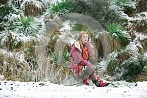 Beautiful asian woman enjoy view with snow during winter in New Zealand.