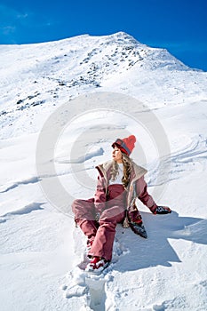 Beautiful asian woman enjoying and relaxing view with snow flake on snow mountain during winter in New Zealand