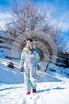 Beautiful asian woman enjoying and relaxing view with snow flake on snow mountain during winter in New Zealand