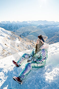 Beautiful asian woman enjoying and relaxing view with snow flake on snow mountain during winter in New Zealand