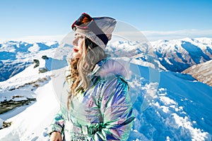 Beautiful asian woman enjoying and relaxing view with snow flake on snow mountain during winter in New Zealand